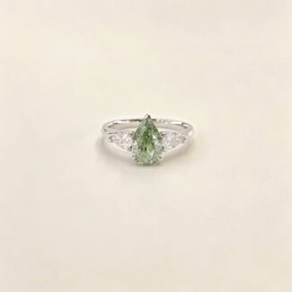Pear cut lab grown diamond three stones engagement ring