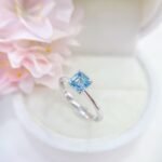 Asscher cut lab grown blue diamond engagement ring