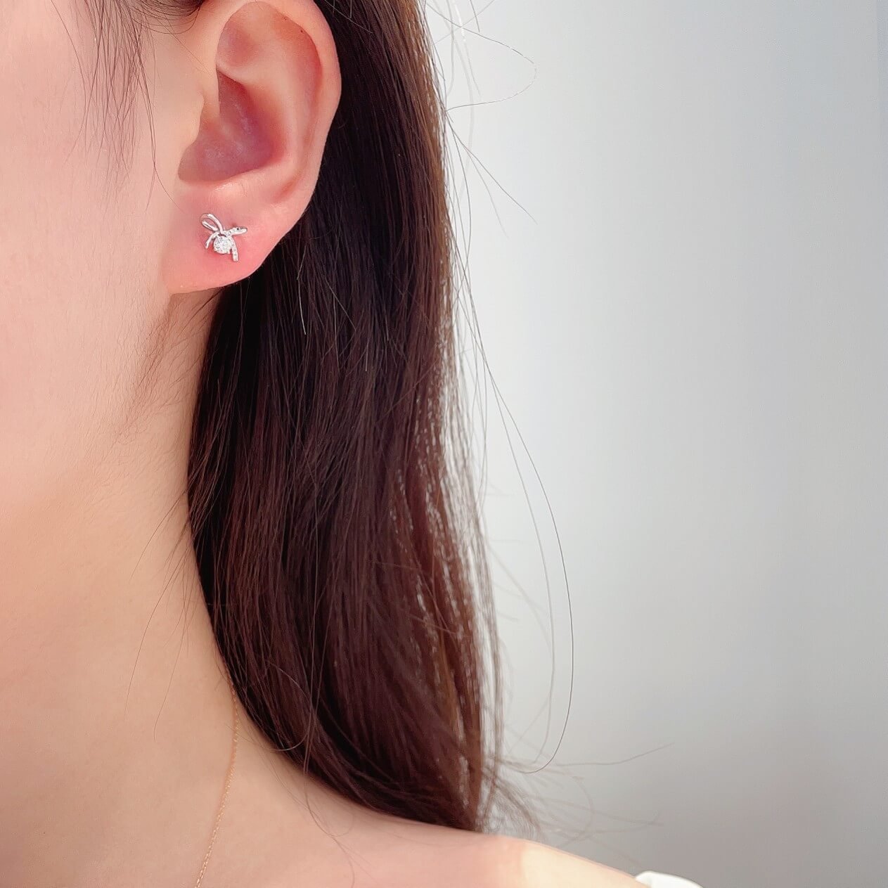 Bow shaped round cut lab grown diamond earrings stud