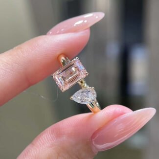 Emerald and pear cut lab grown diamond engagement ring