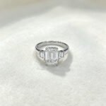 Emerald cut lab grown diamond three stones engagement ring