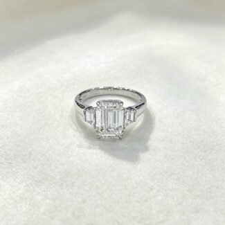 Emerald cut lab grown diamond three stones engagement ring