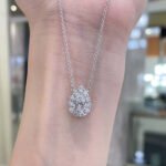 Halo setting pear cut lab grown diamond pendant necklace