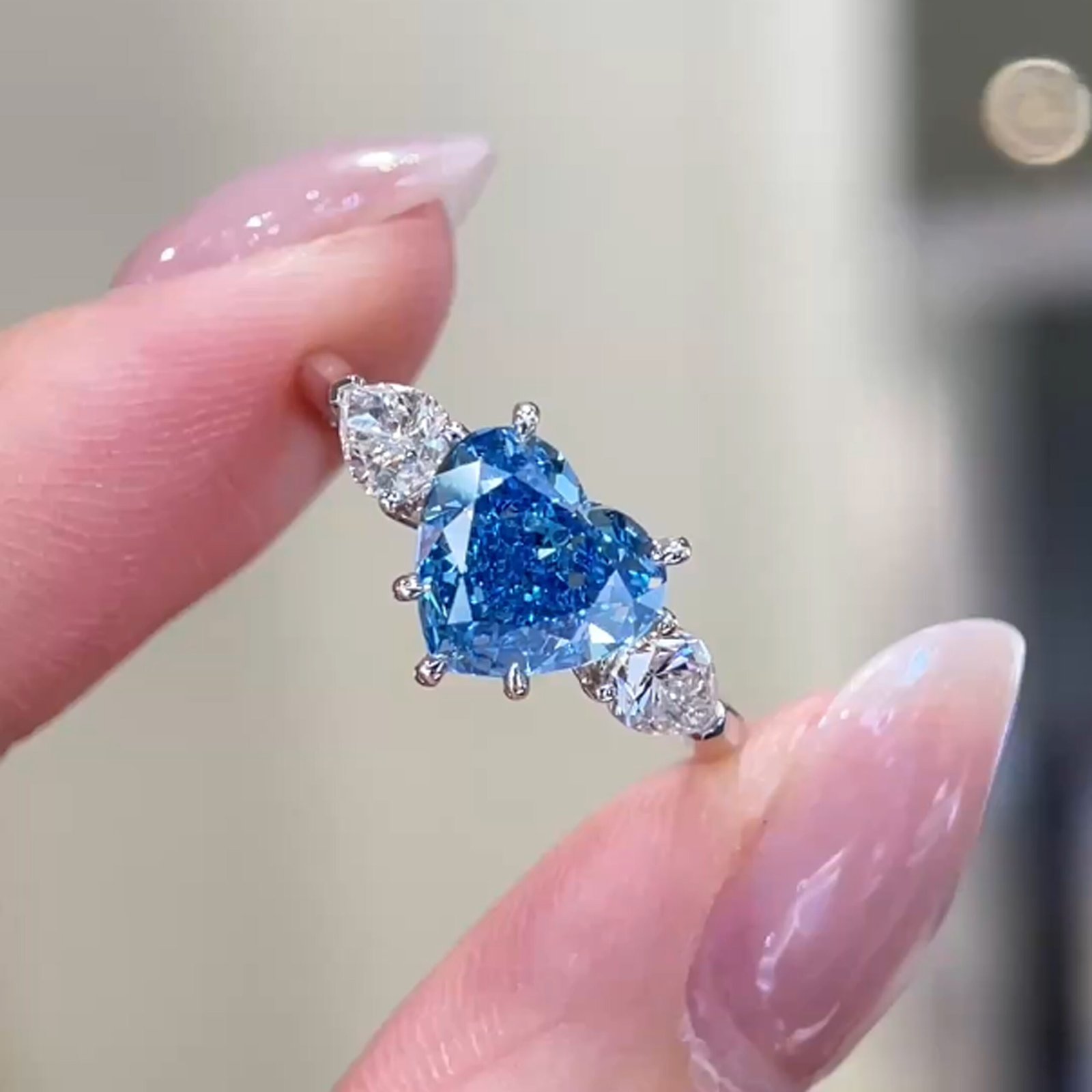 Heart cut lab grown blue diamond three stones engagement ring