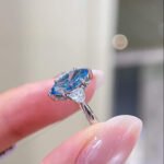 Marquise cut lab grown blue diamond three stones engagement ring