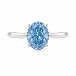 Oval cut lab grown blue diamond engagement ring