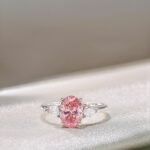 Oval cut lab grown pink diamond three stones engagement ring