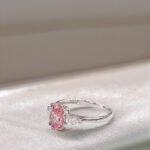 Oval cut lab grown pink diamond three stones engagement ring