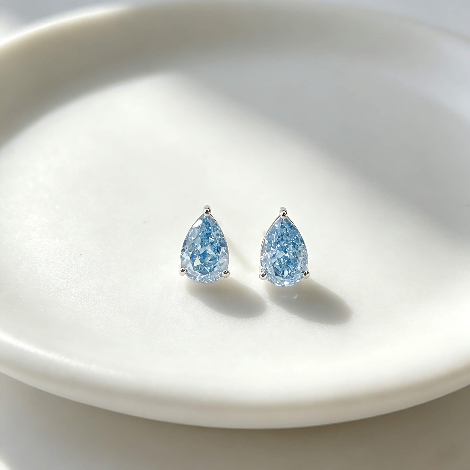 Pear cut lab grown blue diamond earrings stud
