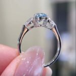 Pear cut lab grown blue diamond three stones engagement ring