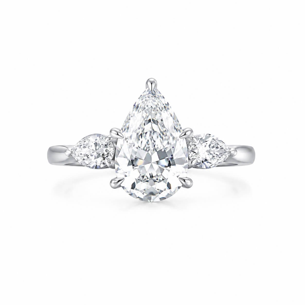 Pear cut lab grown diamond three stones engagement ring
