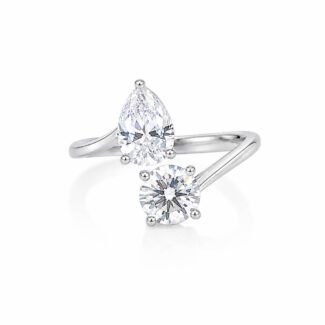 Round and pear cut lab grown diamond engagement ring