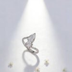 Round and pear cut lab grown diamond engagement ring