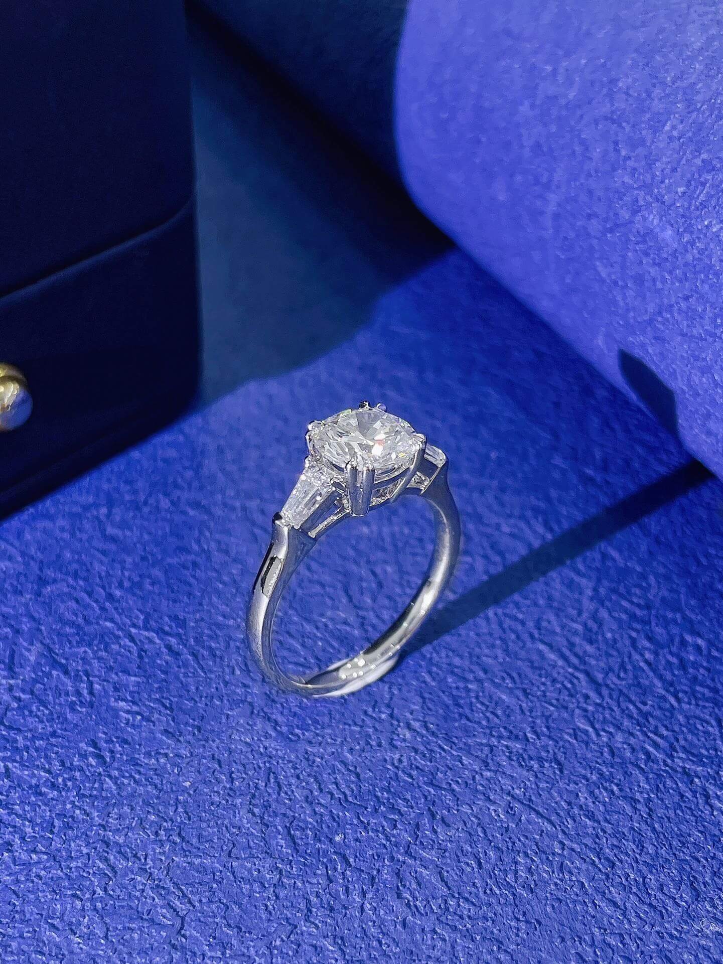 Round cut lab grown diamond three stones engagement ring