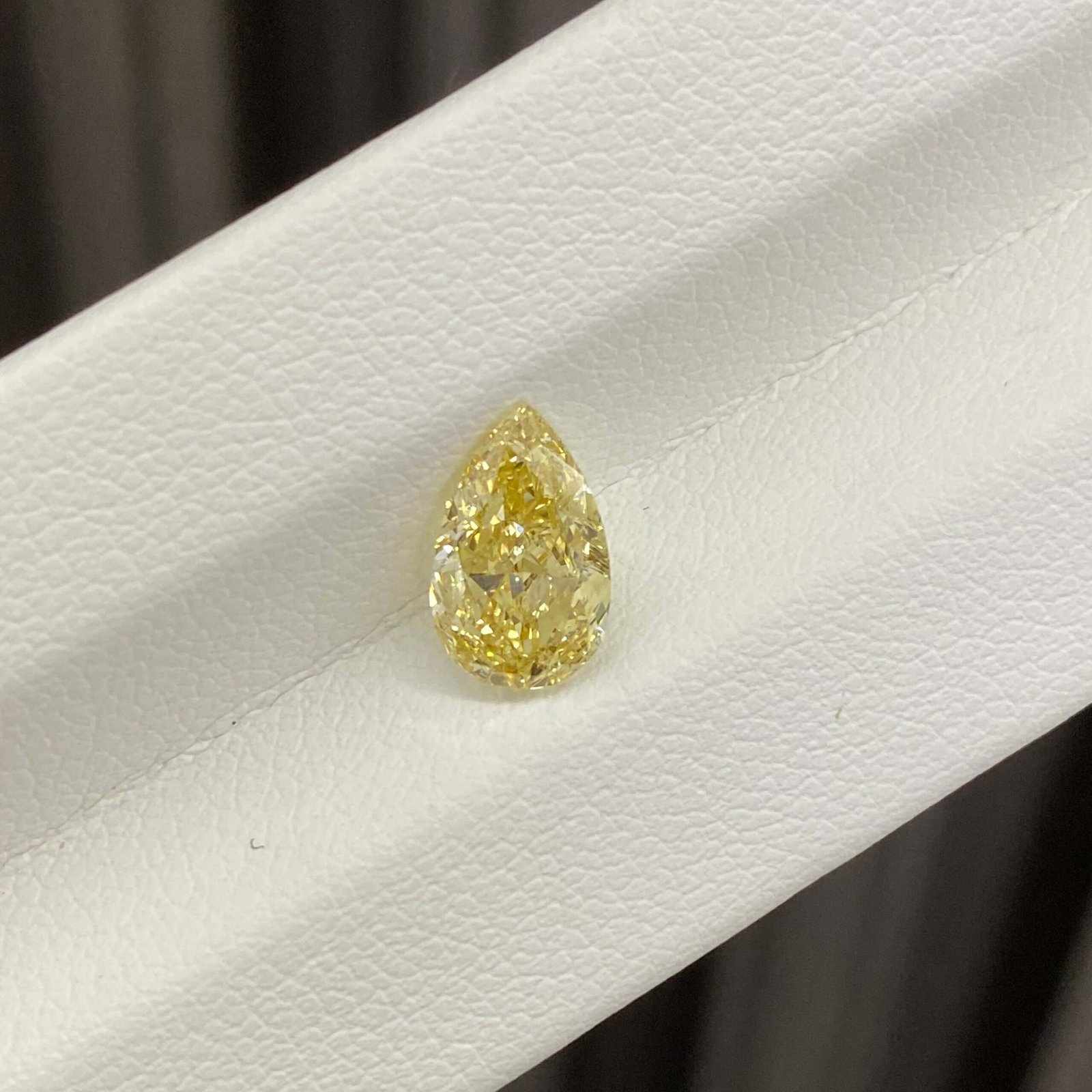 1.67ct pear cut fancy intense yellow lab grown diamond