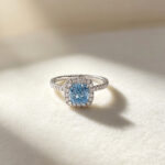 Cushion cut lab grown blue diamond engagement ring