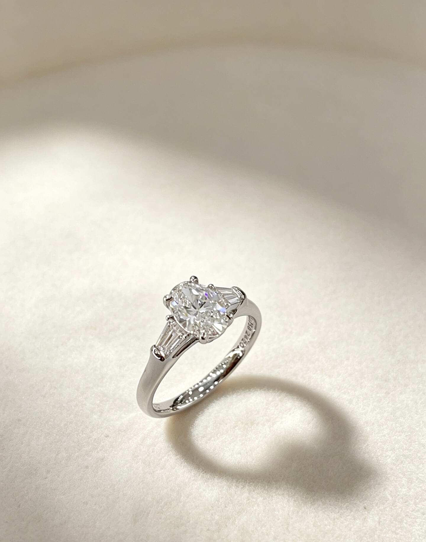 Oval cut lab grown diamond three stones engagement ring