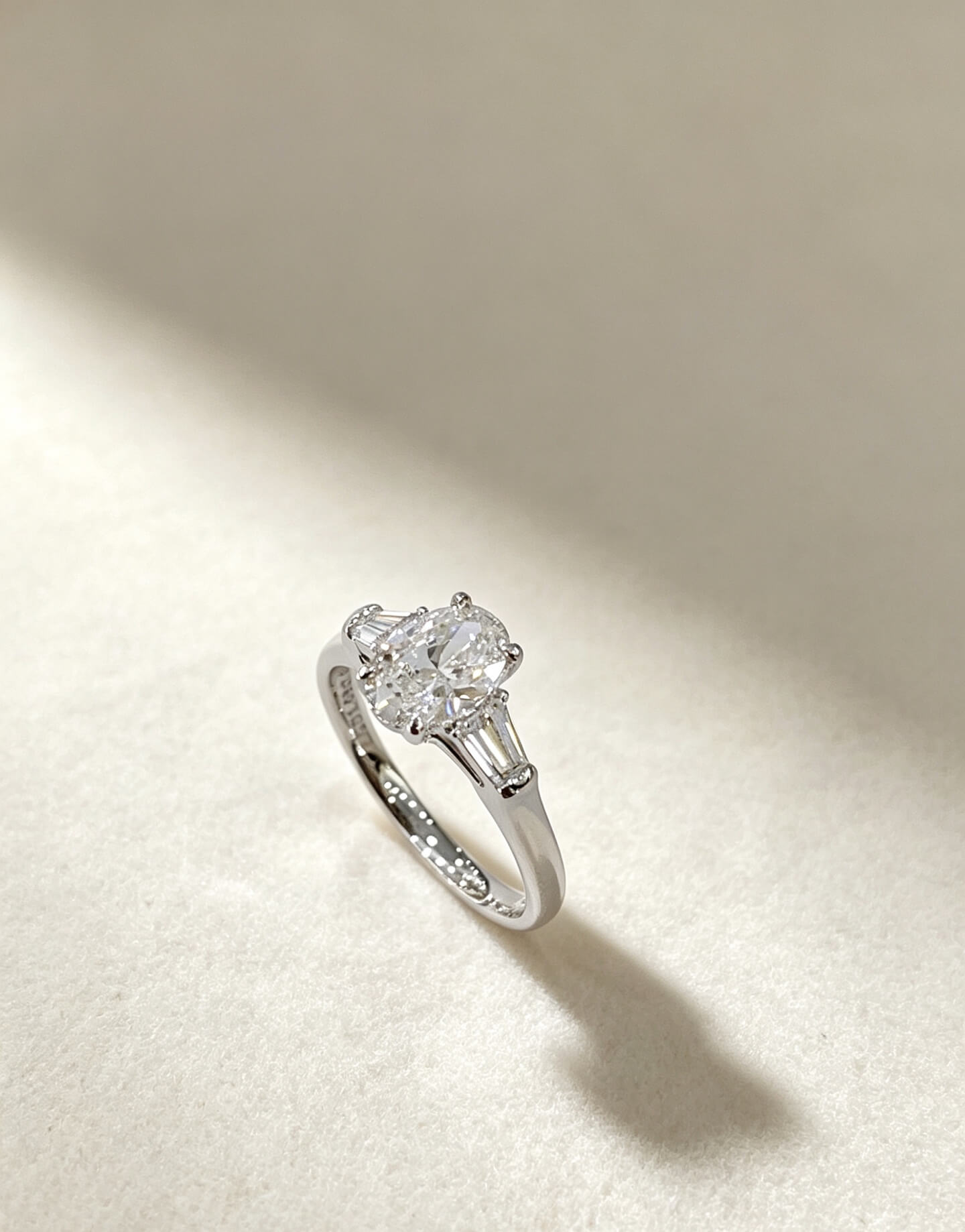 Oval cut lab grown diamond three stones engagement ring