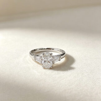 Oval cut lab grown diamond three stones engagement ring
