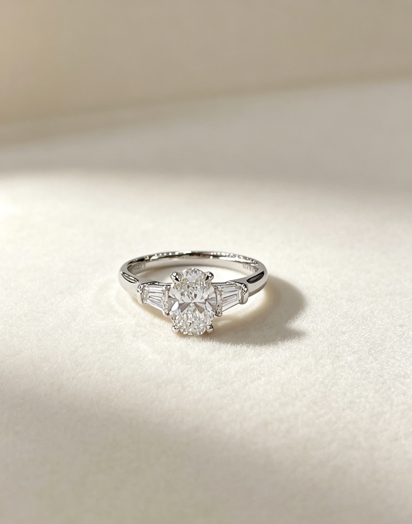 Oval cut lab grown diamond three stones engagement ring