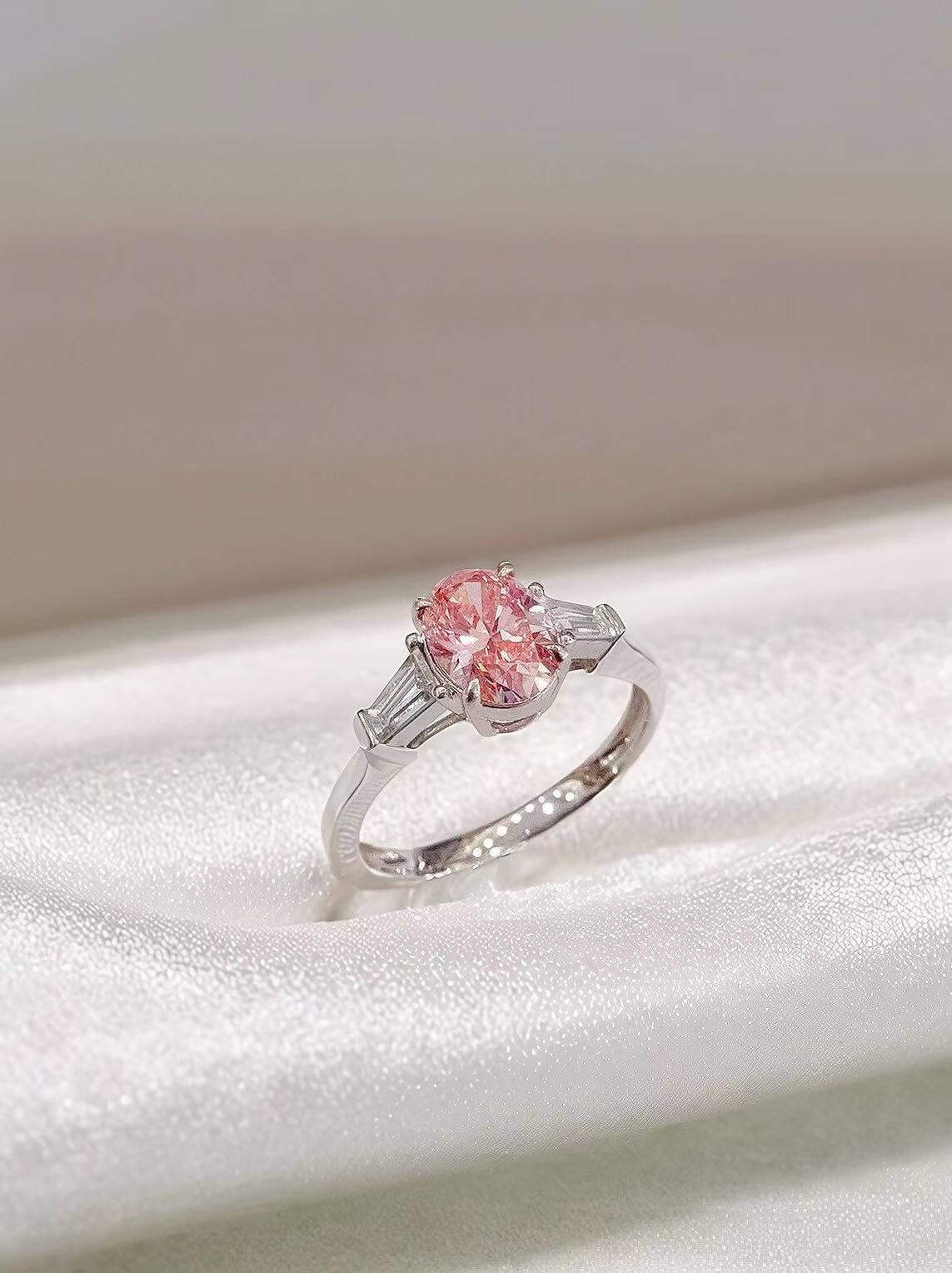 Oval cut lab grown pink diamond three stones engagement ring 02
